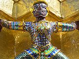Bangkok 04 03 Wat Phra Kaeo Golden Phra Siratana Chedi Demon Here is the detail of one of the demons supporting the golden chedi at Bangkok�s Wat Phra Kaeo.